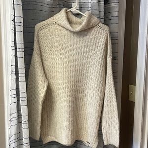 Longer length, turtleneck sweater